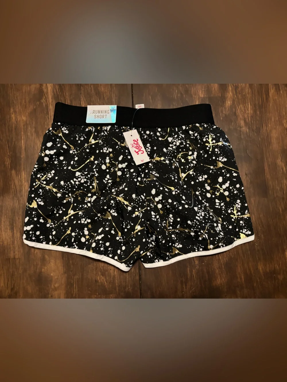 Justice Black Athletic Shorts with White Trim and Gold Splatter